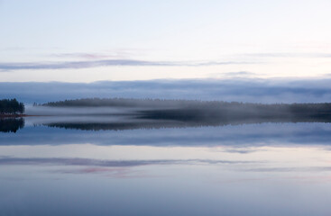 Naklejka premium Foggy landscape in Northern Finland.