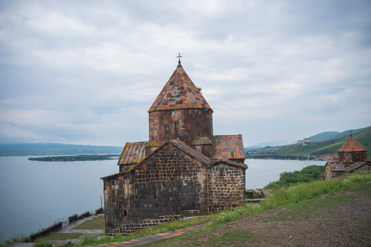 Medieval Sevanavank church on a hill next to Lake Sevan in Armenia with copy space