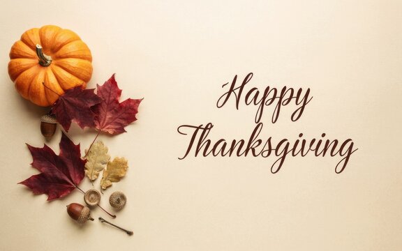 Festive pumpkin and autumn leaves decoration on a beige background for a happy thanksgiving day celebration