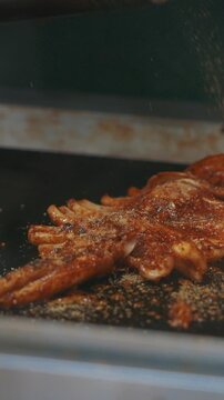 Chengdu, Sichuan, China. Man Frying Squid. Traditional Chinese Snacks. Fried Squid With Green Onions. Chinese Street Food. Street Barbecue. Asian Street Food. Asian Cuisine. Man Frying Squid In Slow