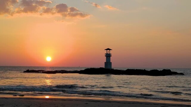 Silhouette  lighthouse with sunset and red twilight sky on the rock at Nang Thong Beach at Khao Lak Phang Nga Thailand - Seascape chill vibe on the beach - beautiful sky - Travel Landscape Thailand 