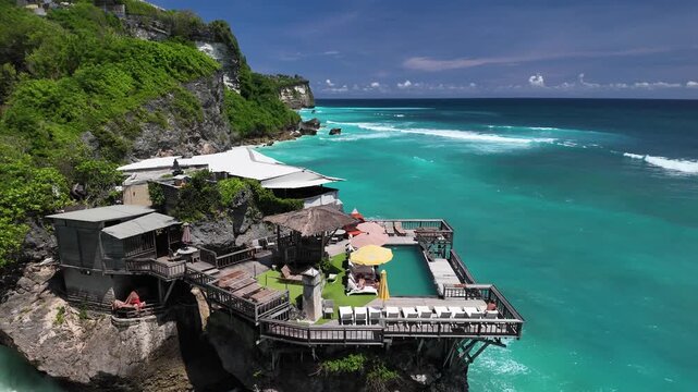 Dramatic coastline with a cliffside cafe at Uluwatu, Bali