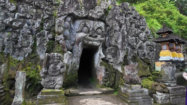 Carved stone entrance of the Goa Gajah elephant cave in Ubud, Bali