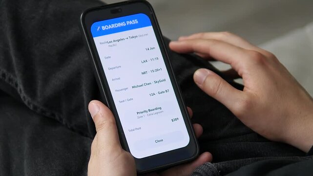 Smartphone displaying digital boarding pass for Los Angeles to Tokyo flight. Shows passenger details, seat 12A, gate B7, priority boarding, and total paid. Perfect for content about air travel