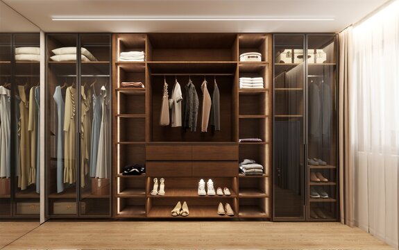 Elegant walk-in wardrobe with dark wood cabinetry, glass doors, integrated lighting, and organized storage. A luxurious modern closet combining style, function, and refined details