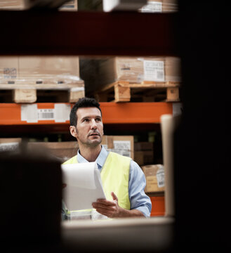 Clipboard, shipping and logistics with man in warehouse for inventory checklist, delivery schedule and cargo. Supply chain, quality control and distribution supervisor with person in factory
