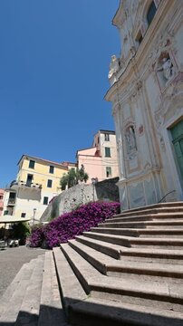 Cervo, liguria, italy. June 22, 2025. Cobblestone staircase leading to the baroque church of san giovanni battista, an iconic landmark in the old town of cervo, liguria, italy