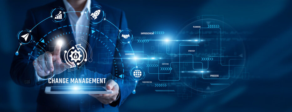 Change Management Consultant using tablet analysing Change Management data. Organizational transformation, process improvement, leadership strategy, workforce adaptation, business resilience