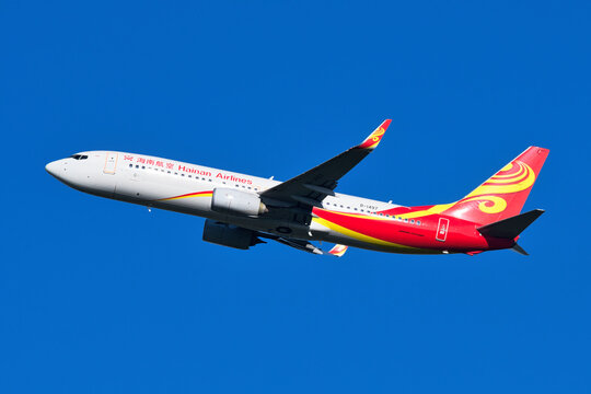 Hainan Airlines Boeing 737-800 (B-1497) passenger plane climbing after takeoff at Narita International Airport