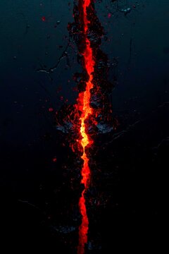 Lava flows violently through cracked earth