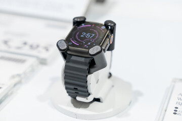 Apple Watch models are displayed in a modern retail environment featuring various case finishes and watch bands. Close-up photographs emphasize the digital display, precision craftsmanship, health sen © hsinwei