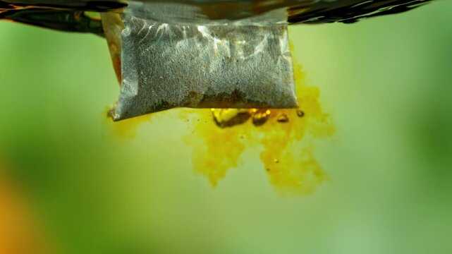 Super Slow Motion of Falling and Extracting Tea Bag in Hot Water at 1000fps.