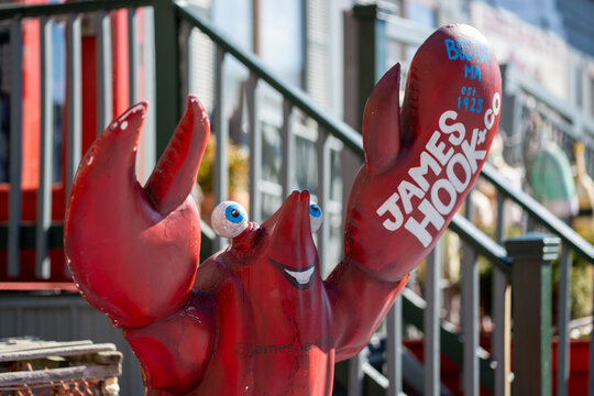 Boston, USA - March 09, 2026: Exterior of James Hook restaurant, a well known seafood destination in Boston, featuring lobster themed branding on a sunny day.