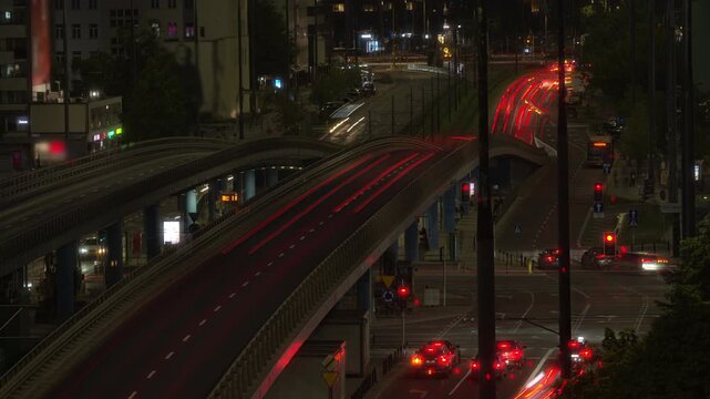 Traffic timelapse city highway night car light trails. Long exposure timelapse video showing abstract streaks of red and white car lights on a multi-lane city highway at night