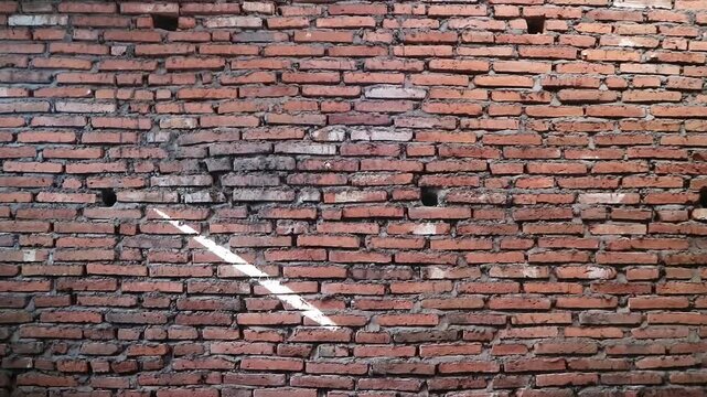 Authentic red brick wall with natural clay tones and gray mortar lines, Perfect for background texture overlays, architectural intros, urban design, motion graphics base layers, rustic or industrial 
