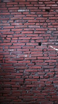 Authentic red brick wall with natural clay tones and gray mortar lines, Perfect for background texture overlays, architectural intros, urban design, motion graphics base layers, rustic or industrial 