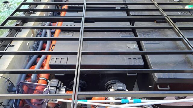Pool filtration system and technical equipment installation with PVC pipes and pumps
