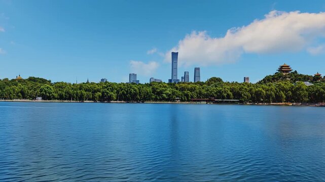 Timelapse of Beijing's Beihai Park showing China Zun skyscraper and CBD skyline from the lakefront.