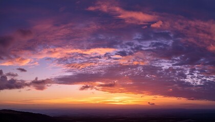 Fototapeta premium Beautiful Vibrant Sunset Sky With Pastel Pink And Purple Clouds Over Orange Horizon In Evening Nature Landscape