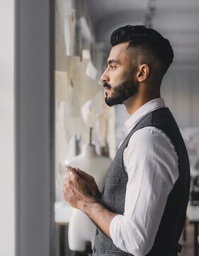 Side View Profile Portrait of Male Fashion Designer by Studio Window
