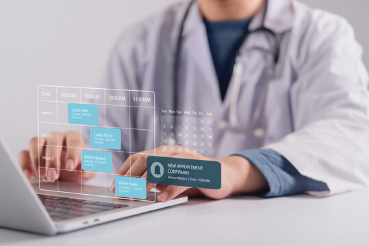 Healthcare professional using laptop with digital appointment scheduling interface and calendar graphics for hospital management system.