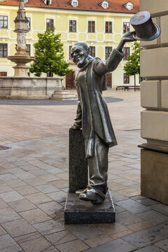 Statue of Schone Naci by Juraj Melis, a famous life size bronze statue  located in the Old Town of Bratislava, Slovakia.