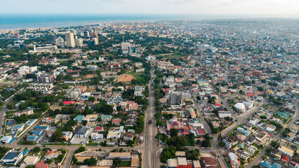 Aerial view of accra, ghana, showcasing city development stretching to the atlantic ocean © Roger