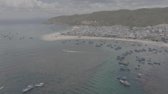 Aerial drone footage of kayaking over seaweed beds at Hon Kho, Gia Lai, Vietnam, featuring crystal-clear water, tropical coastline and an active outdoor adventure near Quy Nhon.