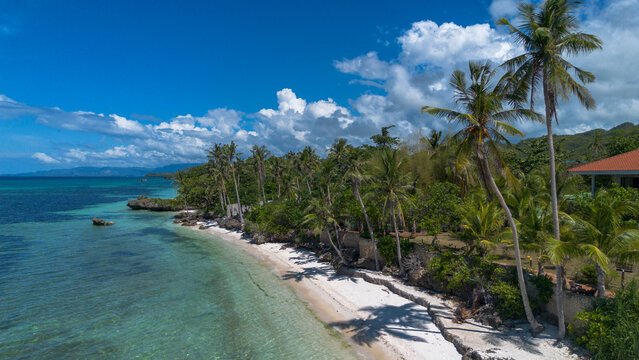 Aerial view of tropical coastline and turquoise lagoon in Anda, Bohol, Philippines