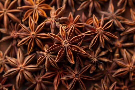 Pile of dried star anise spices texture background