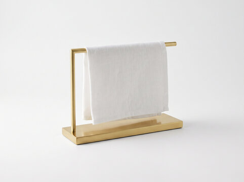 Gold countertop towel stand with white towel isolated