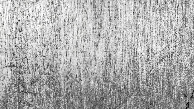 Abstract black and white urban grunge texture featuring a heavily distressed concrete or cement surface with a rough industrial appearance.