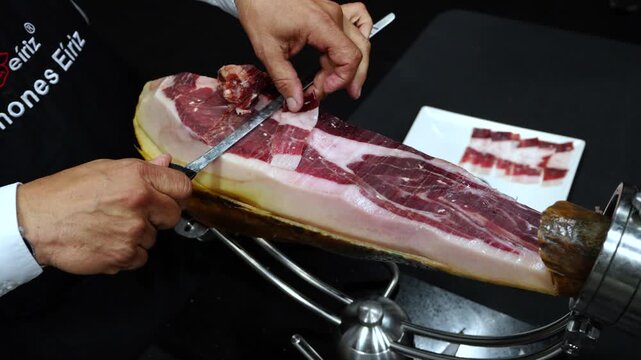 Hand-carved Iberian pork ham in the town of Jabugo, in the municipality of Jabugo, in the Sierra de Aracena and Picos de Aroche Natural Park in Sierra Morena. Province of Huelva. Andalusia. Spain.