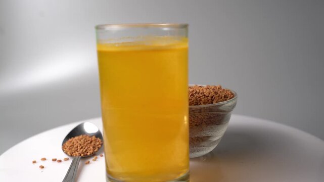 Fenugreek Seeds Soaked in Water (Methi Water) Natural Ayurvedic Drink, Herbal Wellness Beverage, Healthy Morning Detox, Traditional Remedy, and Organic Nutrition