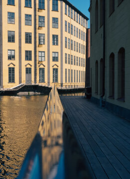Perspective view along a railing in an industrial landscape