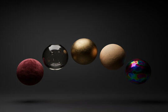 Minimal studio photo of six floating textured spheres on dark background, matte and glossy materials in neutral and vivid colors for modern design