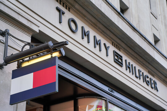London, United Kingdom - May 20, 2023: Tommy Hilfiger logo on one of their branches in UK capital at Regent Street. It is Dutch American fashion brand specializing to mostly clothing founded 1985