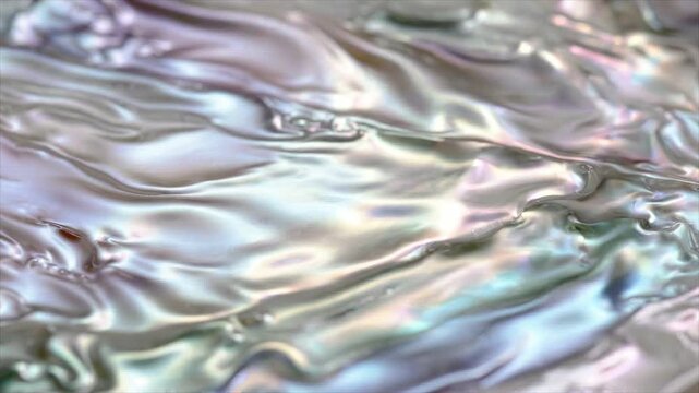 Iridescent mother of pearl texture shimmers with soft rainbow reflections, creating a luxurious seamless background.