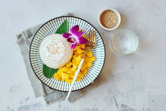 Mango sticky rice on white plate, Thai traditional food