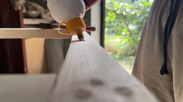 gluing a wooden dowel into a timber beam . High quality 4k footage