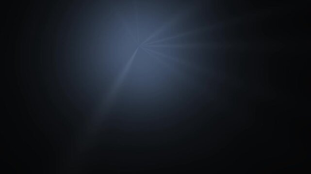 A faint light radiates through a dark atmospheric space creating subtle lens flare effects.