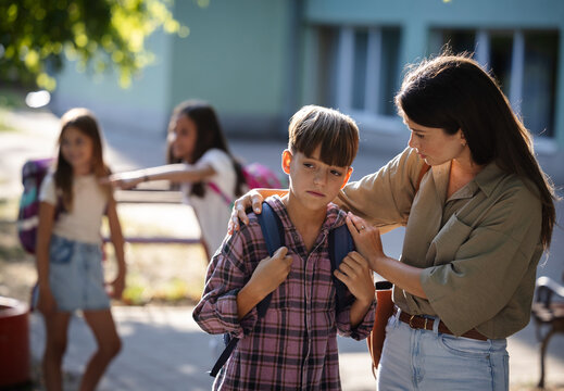 Child receives support from mother before school day starts