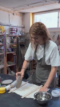 Woman Working with Clay in a Ceramic Studio