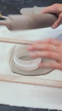 Close-Up of Hands Rolling Out Clay for Ceramic Making