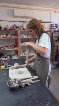 Woman Shaping Ceramics in a Crafts Studio