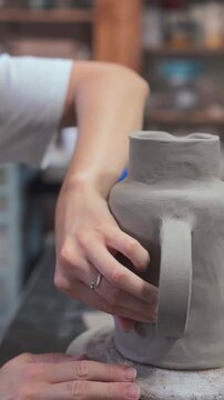 Close-Up of Ceramic Making with Hands Shaping a Pot