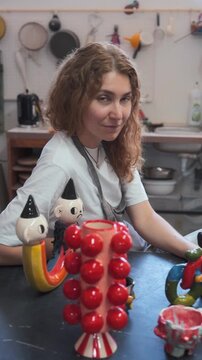 Ceramic Artist Working with Colorful Creations in Studio