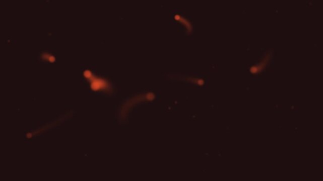 Halloween background of floating will o wisp lights with glowing trails, seamless loop in fiery red and black