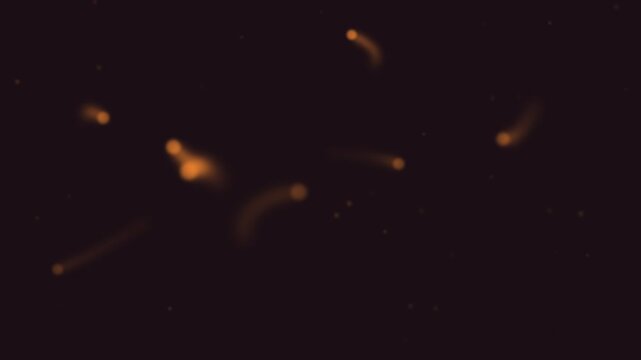 Halloween background of floating will o wisp lights with glowing trails, seamless loop in orange and black