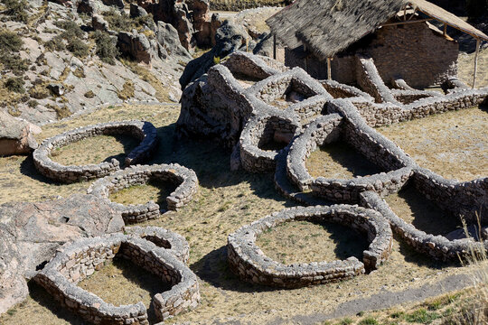 T'aqrachullo rises like a forgotten city carved into stone. Spread across seventeen hectares of windswept mesa in Espinar, Cusco, this ancient citadel holds nearly six hundred structures 